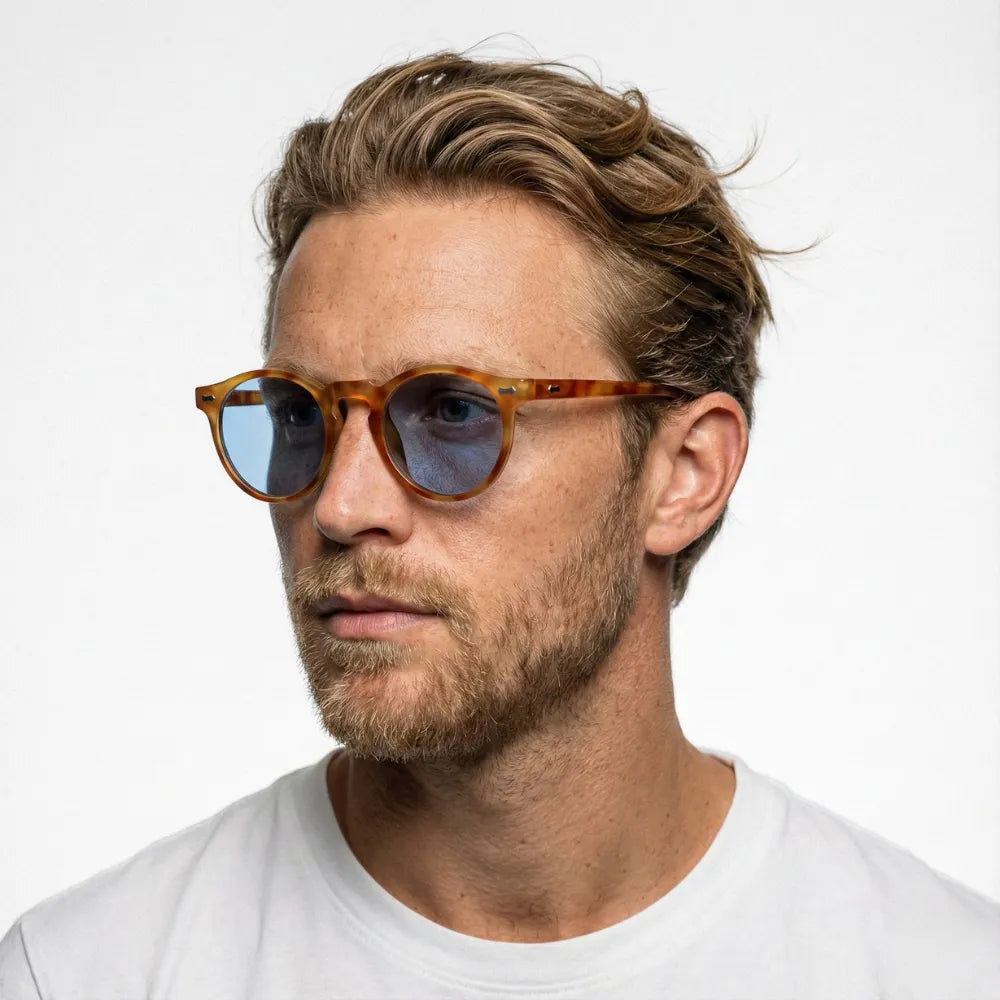 Round acetate sunglasses on a sunlit terrace — HARO Ravello Infinity